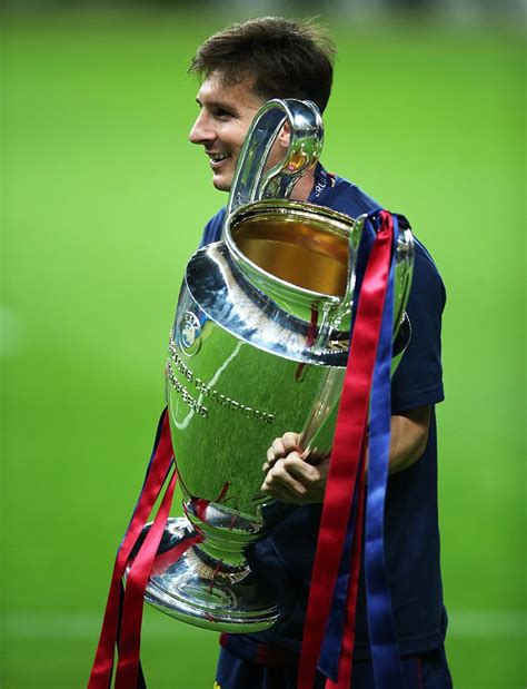 messi with his trophies